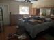 Main bedroom with dresser and a double bed at 34525 Orchid Pkwy, Dade City, FL 33523