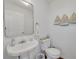 Small half bathroom with pedestal sink and toilet at 4207 Des Prez Ct, Hernando Beach, FL 34607