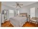 Bright bedroom with hardwood floors and a comfy bed at 4207 Des Prez Ct, Hernando Beach, FL 34607