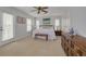 Spacious bedroom with king-size bed and private balcony access at 4207 Des Prez Ct, Hernando Beach, FL 34607