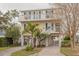 Two-story waterfront home with balcony and palm trees at 4207 Des Prez Ct, Hernando Beach, FL 34607