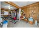 Unfinished garage with various storage items and exercise equipment at 4207 Des Prez Ct, Hernando Beach, FL 34607
