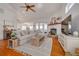 Bright living room with hardwood floors, fireplace, and comfy seating at 4207 Des Prez Ct, Hernando Beach, FL 34607