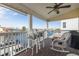Relaxing waterfront deck features wicker furniture, creating the perfect outdoor space at 4207 Des Prez Ct, Hernando Beach, FL 34607