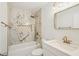 Elegant bathroom with marble walls, gold fixtures, and a large mirror at 4318 1St S Ave, St Petersburg, FL 33711