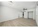 Large bedroom with wood-like floors, and a barn door to the bathroom at 4318 1St S Ave, St Petersburg, FL 33711