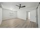 Primary bedroom with ceiling fan and access to bathroom and closet at 4318 1St S Ave, St Petersburg, FL 33711