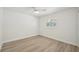 Simple bedroom with wood-look floors and window at 4318 1St S Ave, St Petersburg, FL 33711