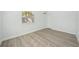 Simple bedroom with light walls and wood-look flooring at 4318 1St S Ave, St Petersburg, FL 33711