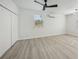 Spacious bedroom with ceiling fan, window, and closet at 4318 1St S Ave, St Petersburg, FL 33711