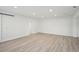 Bright and airy bedroom with light wood floors and barn door at 4318 1St S Ave, St Petersburg, FL 33711