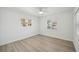 Bright bedroom with neutral walls and wood-look floors at 4318 1St S Ave, St Petersburg, FL 33711