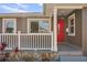 Home exterior with a red door and a stone-accented porch at 4318 1St S Ave, St Petersburg, FL 33711