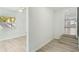 Light and bright hallway with wood-look flooring leading to other rooms at 4318 1St S Ave, St Petersburg, FL 33711
