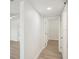 Clean hallway with light walls and wood-look floors at 4318 1St S Ave, St Petersburg, FL 33711