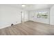 Open concept living room with hardwood floors and a view of the kitchen at 4318 1St S Ave, St Petersburg, FL 33711
