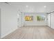 Bright living room with an open floor plan and updated flooring at 4318 1St S Ave, St Petersburg, FL 33711