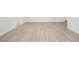 Bright living room featuring light wood flooring and an open floor plan at 4318 1St S Ave, St Petersburg, FL 33711