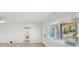 Living room featuring light wood floors and a window with blinds at 4318 1St S Ave, St Petersburg, FL 33711