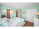 Guest bedroom with coastal decor and wood floors at 4725 Cove Cir # 211, St Petersburg, FL 33708
