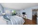 Spacious main bedroom with wood floors and en-suite bathroom at 4725 Cove Cir # 211, St Petersburg, FL 33708