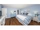 Main bedroom with wood floors and a walk-in closet at 4725 Cove Cir # 211, St Petersburg, FL 33708