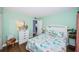Guest bedroom with coastal decor and wood floors at 4725 Cove Cir # 211, St Petersburg, FL 33708