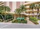 Condo building exterior showcasing manicured landscaping and inviting entrance at 4725 Cove Cir # 211, St Petersburg, FL 33708