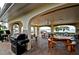 Covered patio with picnic tables, grills, and waterfront views at 4725 Cove Cir # 211, St Petersburg, FL 33708
