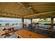 Covered outdoor patio with picnic tables and waterfront views at 4725 Cove Cir # 211, St Petersburg, FL 33708