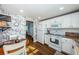 White kitchen with updated appliances and breakfast nook at 4725 Cove Cir # 211, St Petersburg, FL 33708