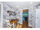 Kitchen with breakfast nook and view into living room at 4725 Cove Cir # 211, St Petersburg, FL 33708