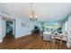 Open and airy living room with hardwood floors and light walls at 4725 Cove Cir # 211, St Petersburg, FL 33708