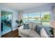 Living room with water views and access to a balcony or patio at 4725 Cove Cir # 211, St Petersburg, FL 33708