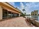 Outdoor patio with seating and waterfront views at 4725 Cove Cir # 211, St Petersburg, FL 33708