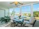 Sunroom with water views and comfortable seating area at 4725 Cove Cir # 211, St Petersburg, FL 33708