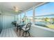 Sunroom with water views and comfortable seating area at 4725 Cove Cir # 211, St Petersburg, FL 33708