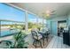 Sunroom with water views and comfortable seating area at 4725 Cove Cir # 211, St Petersburg, FL 33708