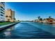 Scenic waterway view with lush landscaping and homes at 4725 Cove Cir # 211, St Petersburg, FL 33708