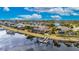 Aerial view of waterfront community with homes and canals at 5253 Brighton Shore Dr, Apollo Beach, FL 33572