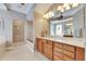 Bathroom with double vanity, granite countertop and a walk-in shower at 5253 Brighton Shore Dr, Apollo Beach, FL 33572