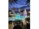 Enjoy resort-style pool with lighthouse water feature at night at 5253 Brighton Shore Dr, Apollo Beach, FL 33572