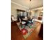 Elegant dining room with hardwood floors and a large china cabinet at 5253 Brighton Shore Dr, Apollo Beach, FL 33572