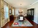 Elegant dining room featuring a wood table, chandelier, and floral rug at 5253 Brighton Shore Dr, Apollo Beach, FL 33572
