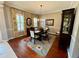Elegant dining room featuring a wood table, chandelier, and floral rug at 5253 Brighton Shore Dr, Apollo Beach, FL 33572