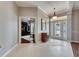 Spacious entryway with tile floors and view into a home office at 5253 Brighton Shore Dr, Apollo Beach, FL 33572