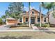 Inviting house exterior with a charming front porch and landscaping at 5253 Brighton Shore Dr, Apollo Beach, FL 33572