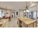Gourmet kitchen featuring granite island, breakfast bar, and stainless steel appliances at 5253 Brighton Shore Dr, Apollo Beach, FL 33572
