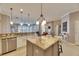 Island kitchen with granite countertops and stainless steel appliances at 5253 Brighton Shore Dr, Apollo Beach, FL 33572