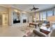 Spacious living room with a cozy fireplace and water views at 5253 Brighton Shore Dr, Apollo Beach, FL 33572
